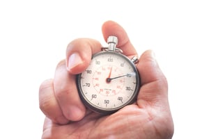 bigstock-Hand-Holding-A-Stopwatch-Isola-332649499