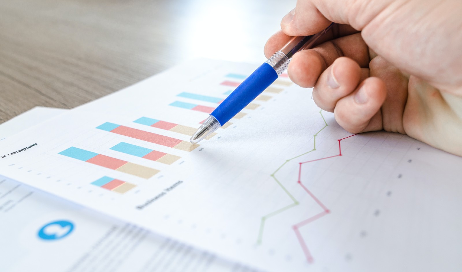 Digital marketer studying chart with data